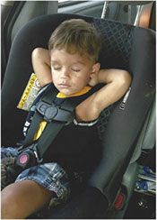 Child sleeping in car seat